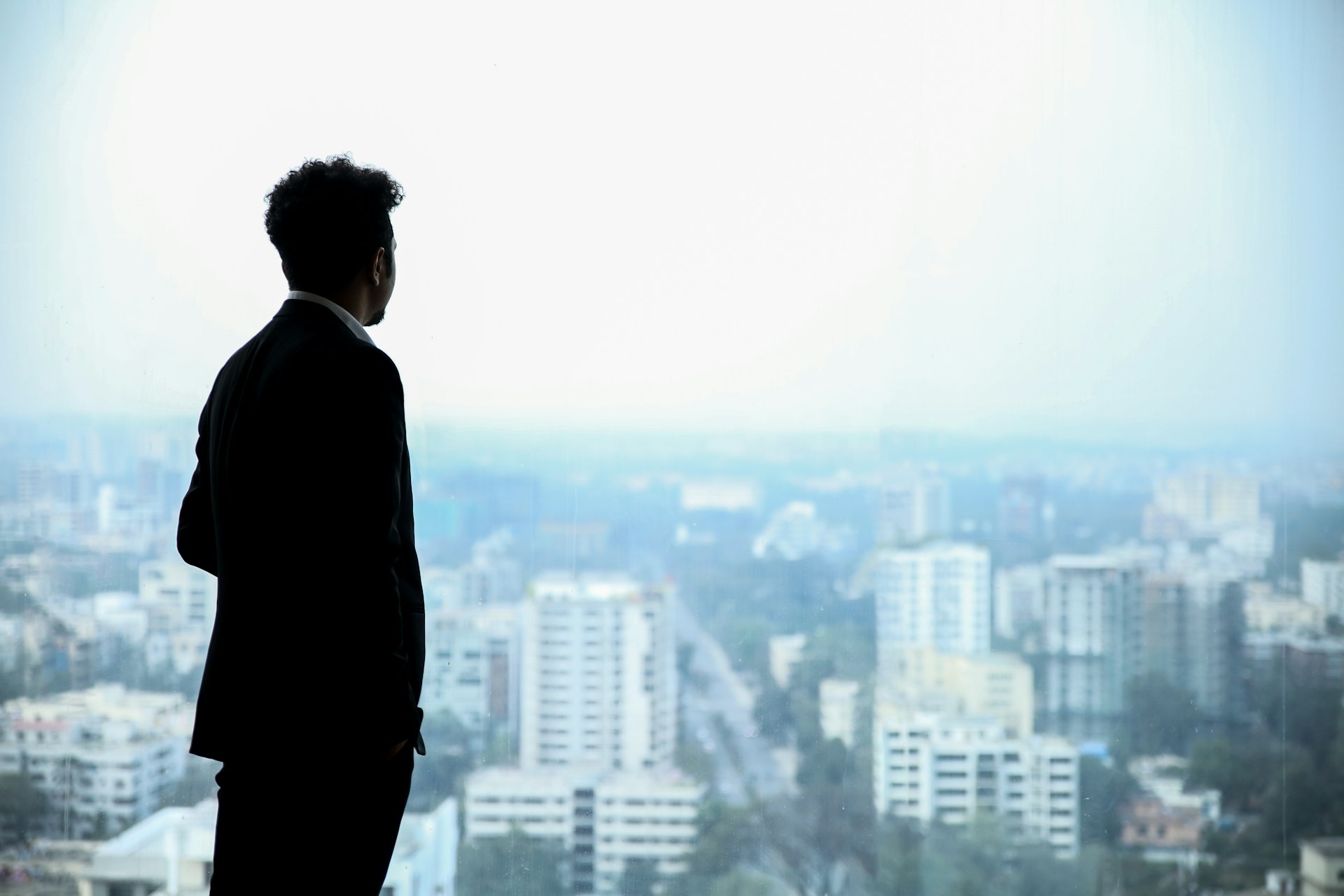 man looking in far Corporate Advisory & Expansion